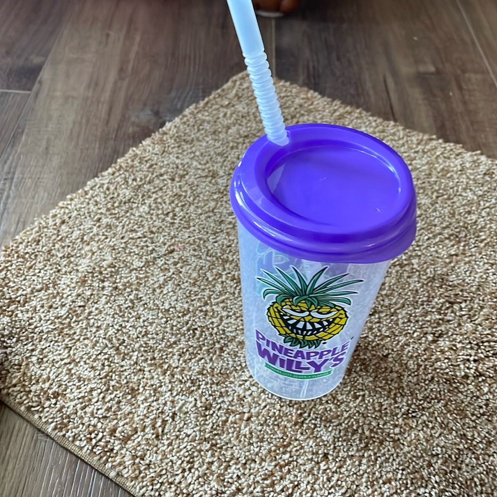 Pineapple Willy’s plastic cup with straw